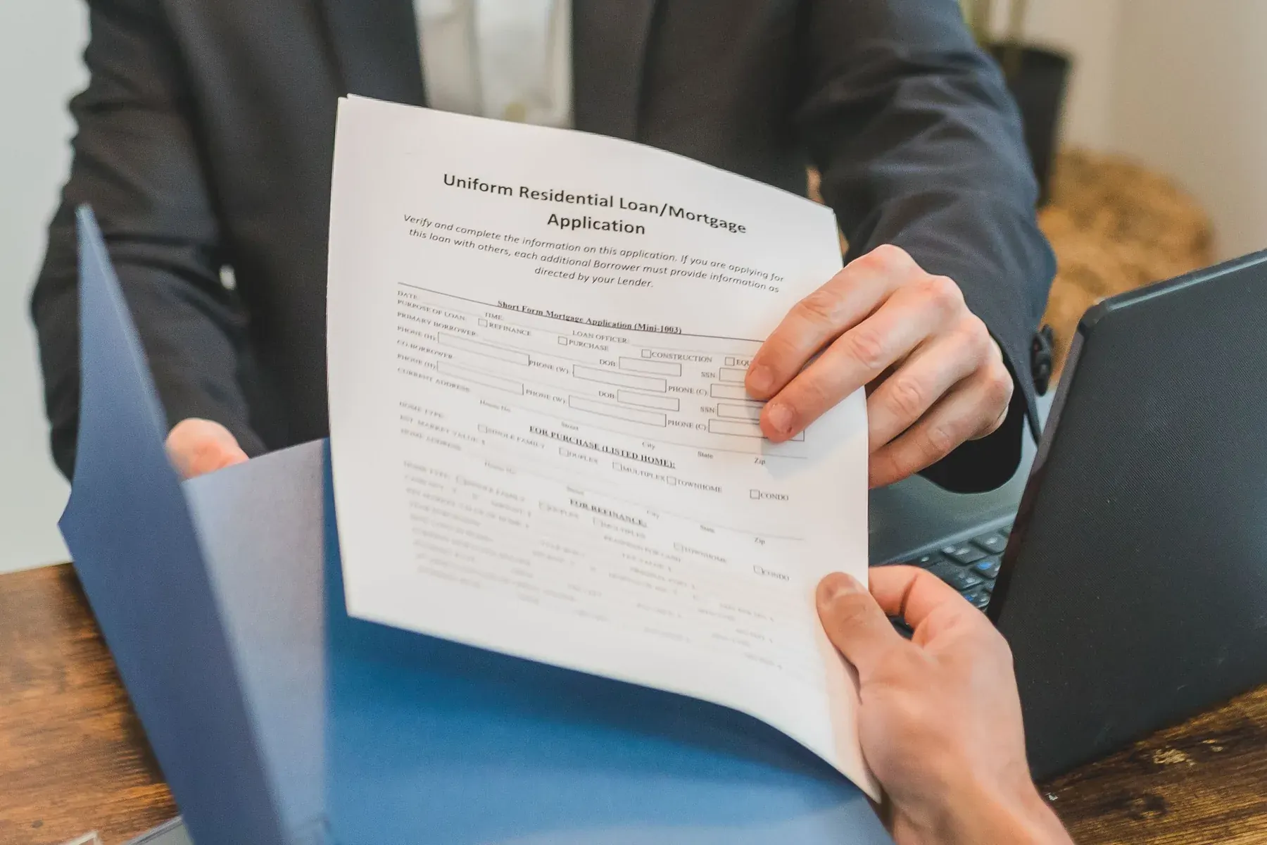 Loan application documents being reviewed